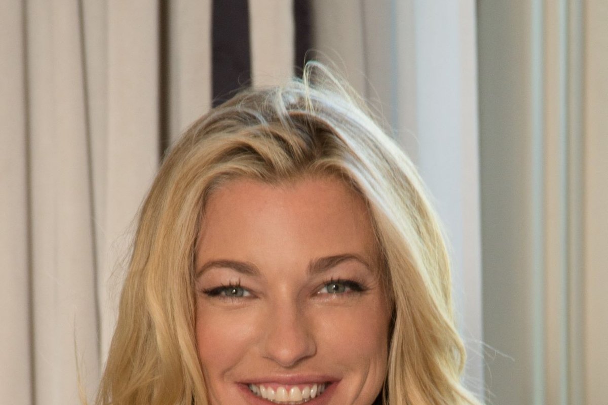 Nicole Junkerman smiling warmly indoors